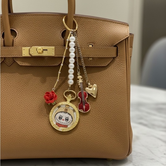 Luxe Handbags - NEW LABUBU Tan Handbag CHARM with Gold and Red Charms KEYCHAIN VIOLIN ROSE